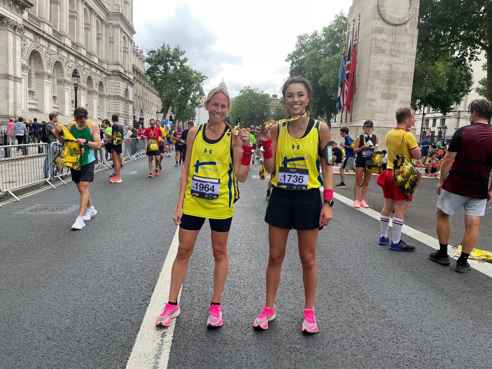 Kerry and Troi in their Tom's Trust running vests during a race